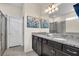 Primary bathroom with granite double vanity and walk-in shower at 1870 Summer Dr, Davenport, FL 33897