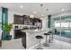 Modern kitchen with granite countertops, stainless steel appliances, and an island at 1870 Summer Dr, Davenport, FL 33897