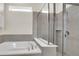 Bathroom features a soaking tub and a walk-in shower with glass enclosure at 1870 Summer Dr, Davenport, FL 33897