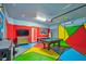 Fun game room with pool table, air hockey, and vibrant decor at 1870 Summer Dr, Davenport, FL 33897
