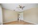 Light-filled bedroom with ceiling fan and wood floors at 431 Geneva Dr, Oviedo, FL 32765