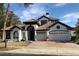 Two-story home with tile roof and attached garage at 204 Chelsea Ave, Davenport, FL 33837