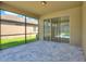 Spacious screened patio with sliding glass doors and pavers at 547 Vigo St, Davenport, FL 33837