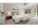 Main bedroom with plush bedding and a bench at the foot of the bed at 334 Chadwick Dr, Davenport, FL 33837