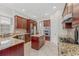 Spacious kitchen with granite countertops, stainless steel appliances, and ample cabinetry at 334 Chadwick Dr, Davenport, FL 33837