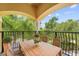 Charming balcony with wooden table and chairs, offering scenic views at 334 Chadwick Dr, Davenport, FL 33837