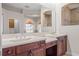 Elegant bathroom with double sinks and a large vanity at 334 Chadwick Dr, Davenport, FL 33837