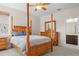 Bedroom with a four-poster bed and ensuite access at 334 Chadwick Dr, Davenport, FL 33837