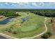 Aerial view of the golf course with ponds and greens at 334 Chadwick Dr, Davenport, FL 33837
