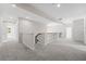 Upstairs hallway with neutral carpeting and access to bedrooms at 334 Chadwick Dr, Davenport, FL 33837