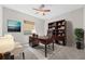 Home office with large desk, bookcase, and comfortable seating at 334 Chadwick Dr, Davenport, FL 33837