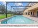Relaxing pool area with a screened enclosure at 334 Chadwick Dr, Davenport, FL 33837