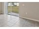 Bright breakfast room with tile floors and sliding glass doors leading to backyard at 1728 Forest Run Ln, Auburndale, FL 33823