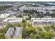 Aerial showing townhouses, surrounded by lush trees, located in a vibrant urban setting at 31 W Harding St, Orlando, FL 32806