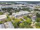Aerial view showcasing a row of contemporary townhouses nestled in a tree-lined neighborhood at 31 W Harding St, Orlando, FL 32806