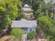Aerial view of a charming bungalow-style house with a well-maintained yard in a residential area at 31 W Harding St, Orlando, FL 32806