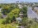Aerial view showing a house surrounded by trees and buildings, showcasing its location at 31 W Harding St, Orlando, FL 32806