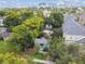 Aerial view of a charming bungalow nestled among lush greenery, showcasing its curb appeal at 31 W Harding St, Orlando, FL 32806
