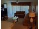 Living room with sectional sofa and glass coffee table at 6182 Willowpointe # B201, Orlando, FL 32822