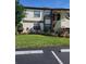 Well-maintained condo building with landscaping and private parking at 6182 Willowpointe # B201, Orlando, FL 32822