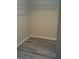 Large walk-in closet featuring wire shelving and laminate flooring at 5593 Vigo Loop, Saint Cloud, FL 34771