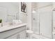 Clean bathroom with a walk-in shower, vanity, and toilet at 1552 Plunker Dr, Davenport, FL 33896