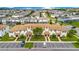 Aerial view of townhouses with tile roofs, and community at 1552 Plunker Dr, Davenport, FL 33896