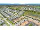 Aerial view of community, showcasing townhouses and green spaces at 1552 Plunker Dr, Davenport, FL 33896