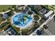 Aerial view of a community pool with water features and lounge chairs at 1552 Plunker Dr, Davenport, FL 33896