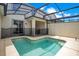 Private screened pool with patio and seating area at 1552 Plunker Dr, Davenport, FL 33896