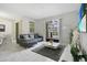 Spacious living room with gray sectional sofa and pool view at 1552 Plunker Dr, Davenport, FL 33896