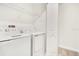 Laundry room with washer, dryer, and shelving at 1552 Plunker Dr, Davenport, FL 33896