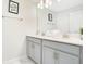 Double vanity bathroom with a large mirror and ample storage at 1552 Plunker Dr, Davenport, FL 33896