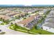 Aerial view of townhouses, community pool, and surrounding area at 1552 Plunker Dr, Davenport, FL 33896