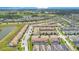 Aerial view of community, showing townhouses and landscape at 1552 Plunker Dr, Davenport, FL 33896