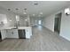 Spacious living room with an open floor plan and wood-look flooring at 15096 Sw 51St Ave, Ocala, FL 34473