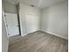 Bright bedroom featuring wood-look floors and spacious closet at 15096 Sw 51St Ave, Ocala, FL 34473