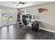 Home office with built-in desk and access to a balcony at 7220 Grace Rd, Orlando, FL 32819