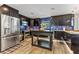 Modern kitchen with stainless steel appliances and a large island at 7220 Grace Rd, Orlando, FL 32819