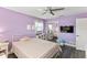 Light purple bedroom with a double bed and mirrored closet at 7220 Grace Rd, Orlando, FL 32819