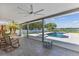 Enclosed patio overlooking the pool and lake at 7220 Grace Rd, Orlando, FL 32819