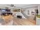 Spacious living room with hardwood floors and views of kitchen and office area at 7220 Grace Rd, Orlando, FL 32819