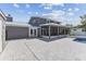 Home's backyard features a patio, pool, and screened lanai at 7220 Grace Rd, Orlando, FL 32819