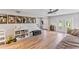 Bright living room with hardwood floors, staircase, and plenty of natural light at 7220 Grace Rd, Orlando, FL 32819