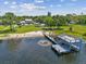 Lakefront property with a large dock and beautiful views at 7220 Grace Rd, Orlando, FL 32819