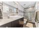Modern bathroom with walk-in shower and double vanity at 7220 Grace Rd, Orlando, FL 32819