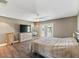 Main bedroom with large bed, dresser, and access to a balcony at 7220 Grace Rd, Orlando, FL 32819