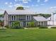 Two-story home with metal roof and large yard at 7220 Grace Rd, Orlando, FL 32819