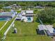 Aerial view showing home, pool, large backyard and lake at 7220 Grace Rd, Orlando, FL 32819
