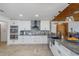Modern kitchen featuring white cabinets, stainless steel appliances, and a large island at 3355 Scarlet Dr, Sanford, FL 32773